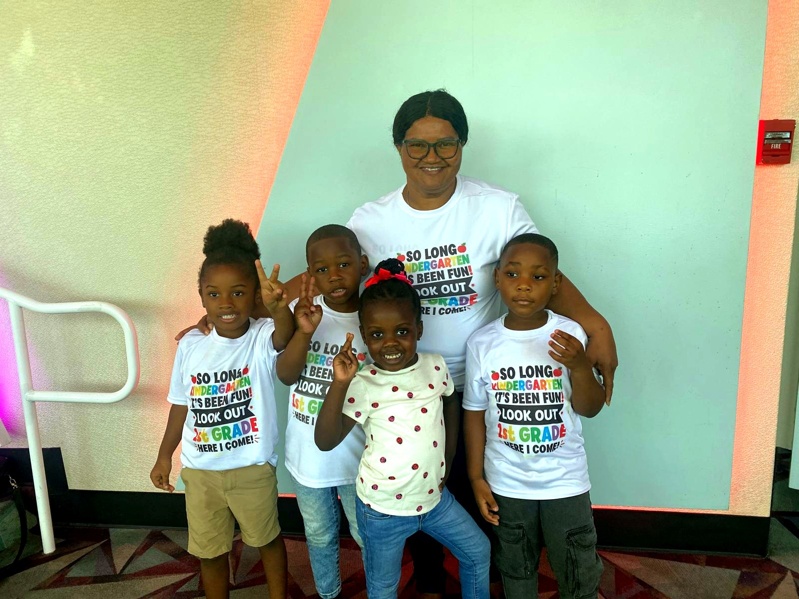 KCLS Academy primary school students celebrating with a community leader