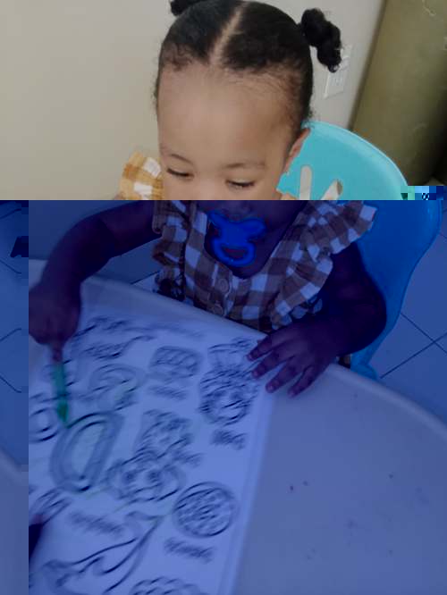 Toddler coloring at the table
